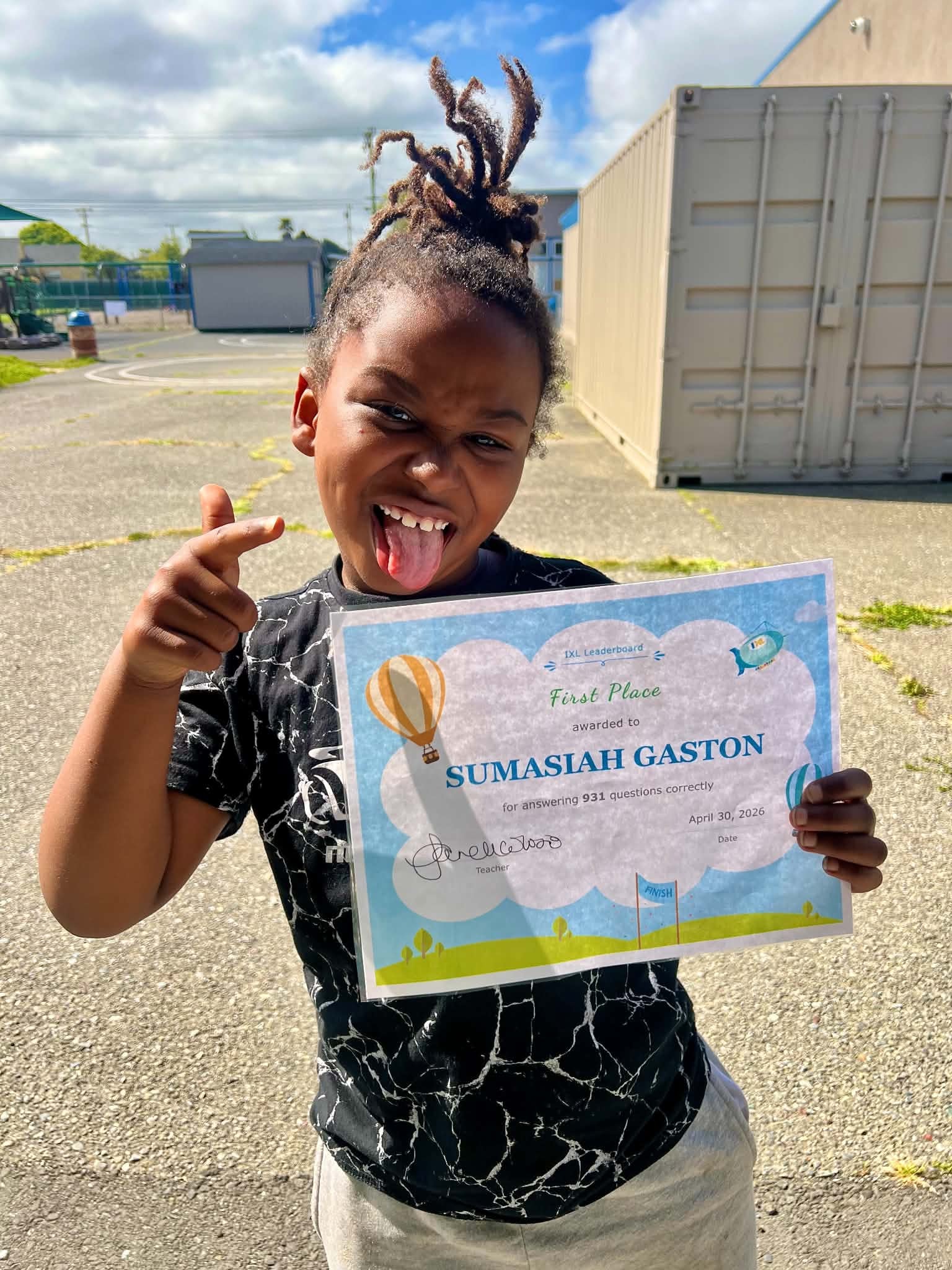 Child celebrating a first-place academic certificate