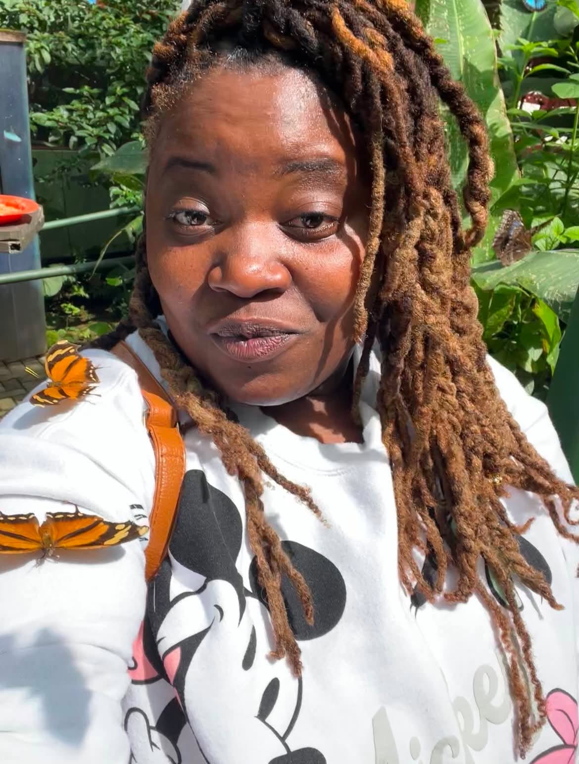 Community member visiting a butterfly garden