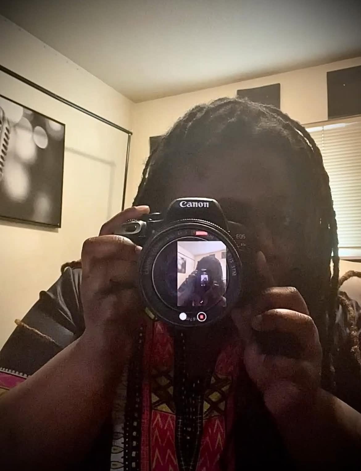 Community member capturing a creative camera self-portrait