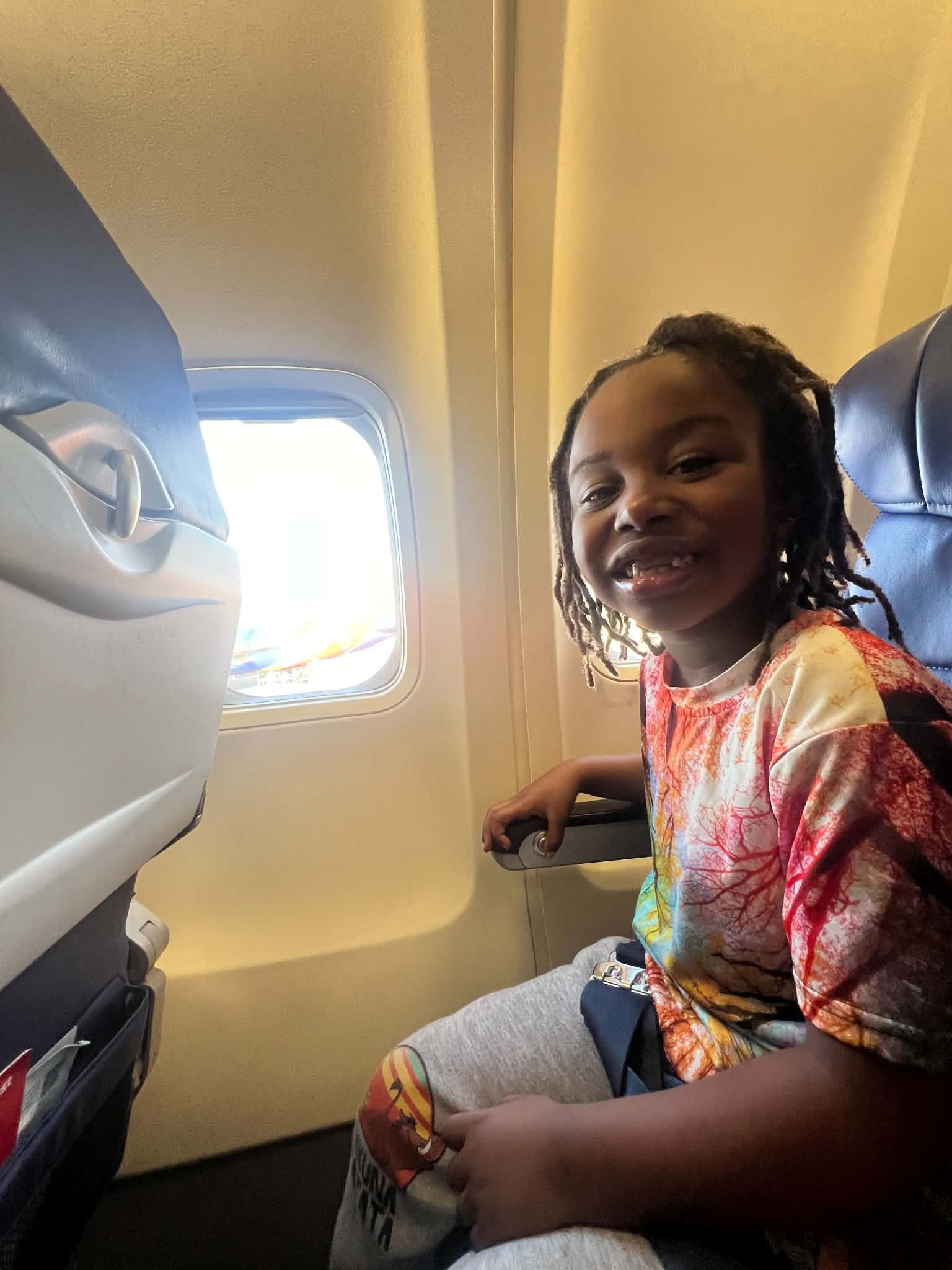Child enjoying a trip by airplane