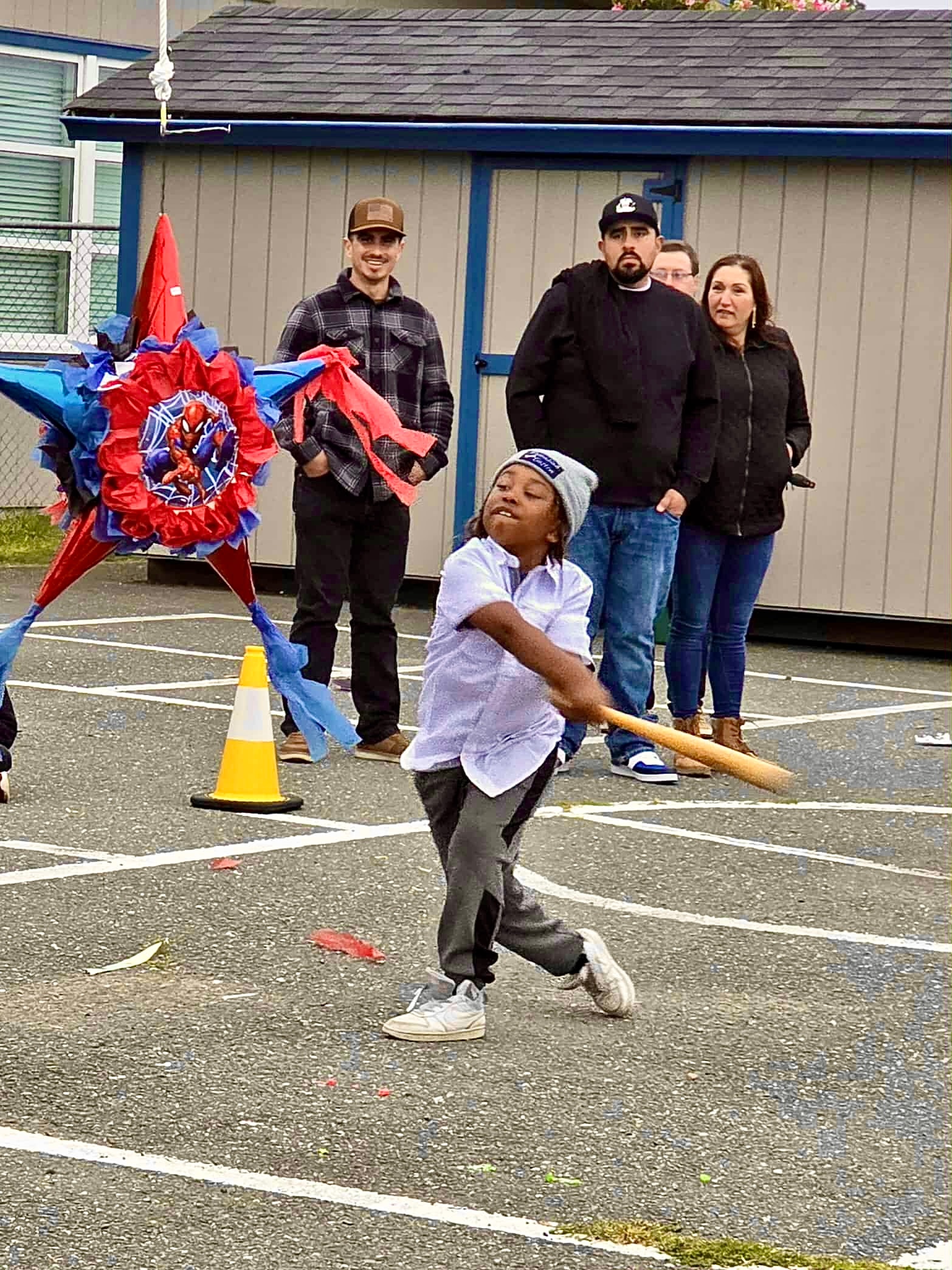 Child enjoying a baseball-themed community activity