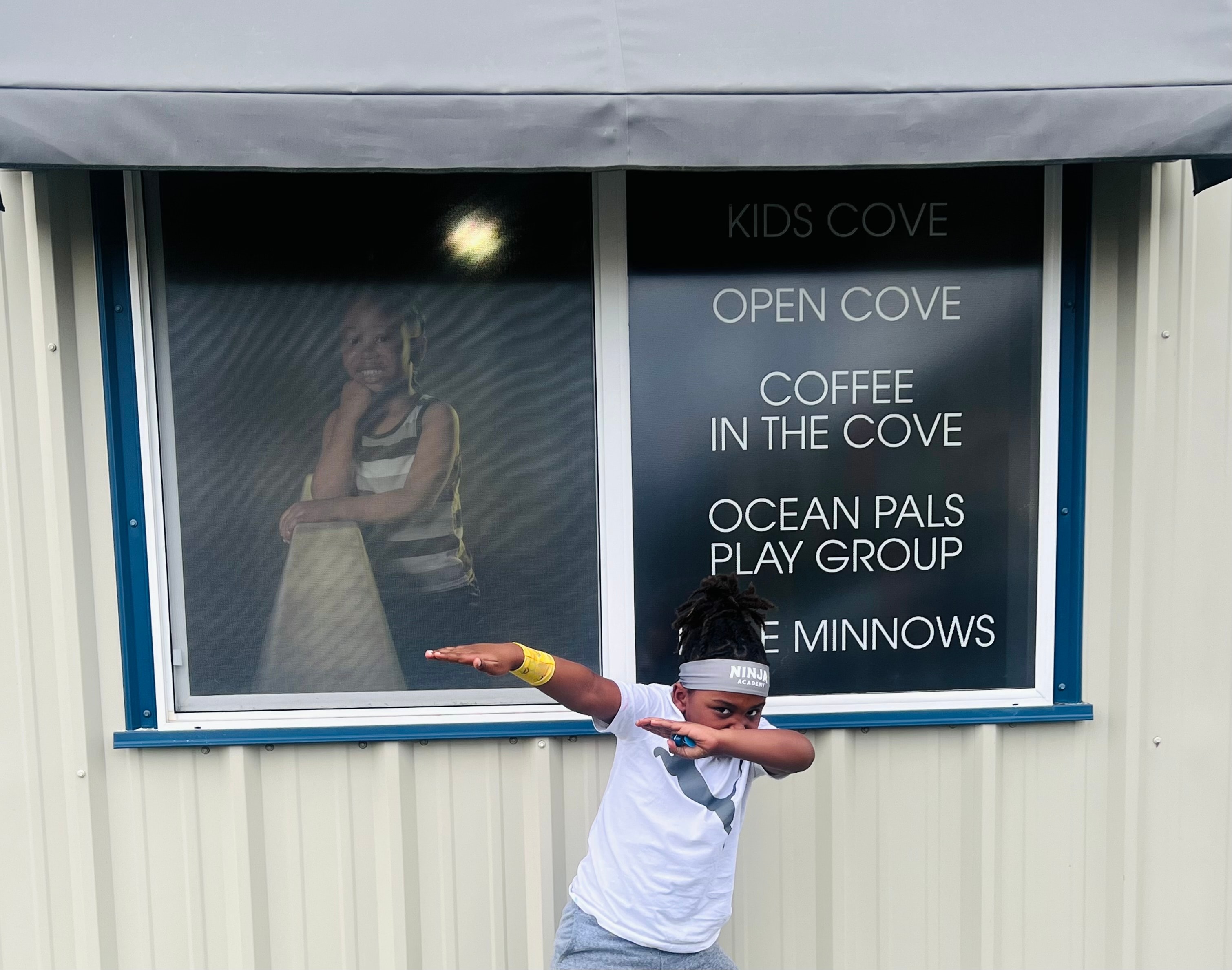 Child at a Kids Cove community activity