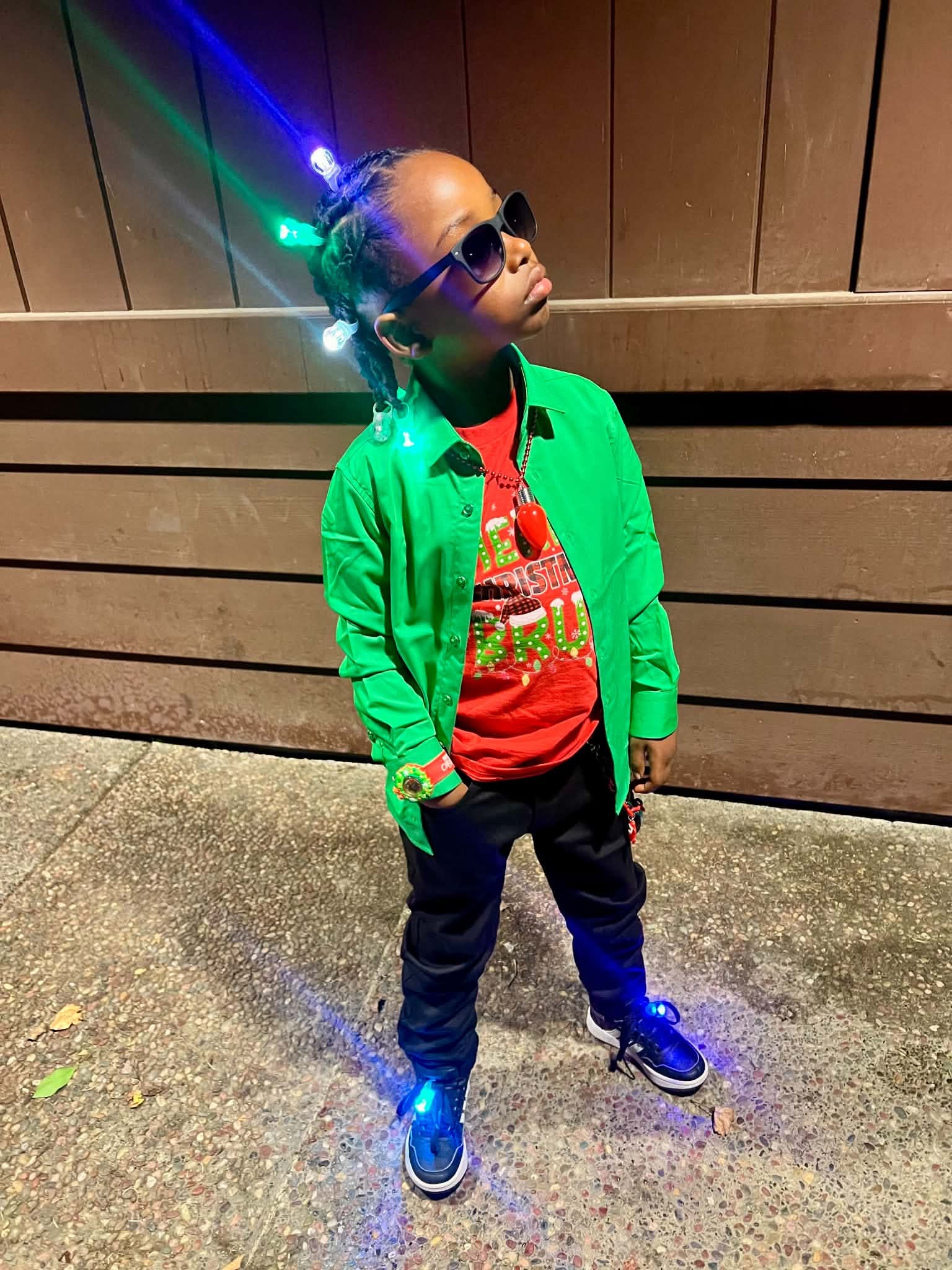 Child wearing a bright jacket and light-up sneakers