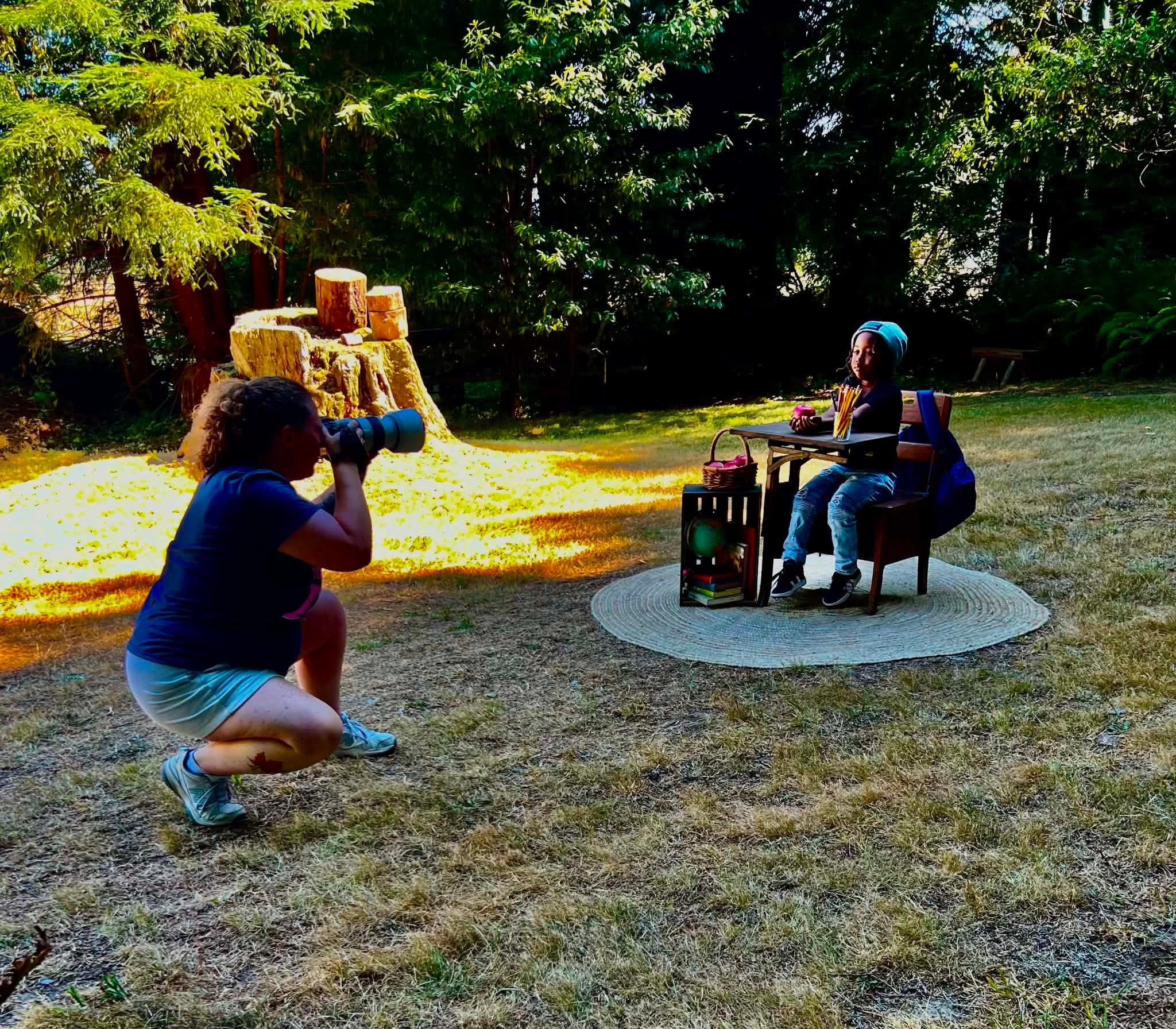 Child participating in an outdoor photography session