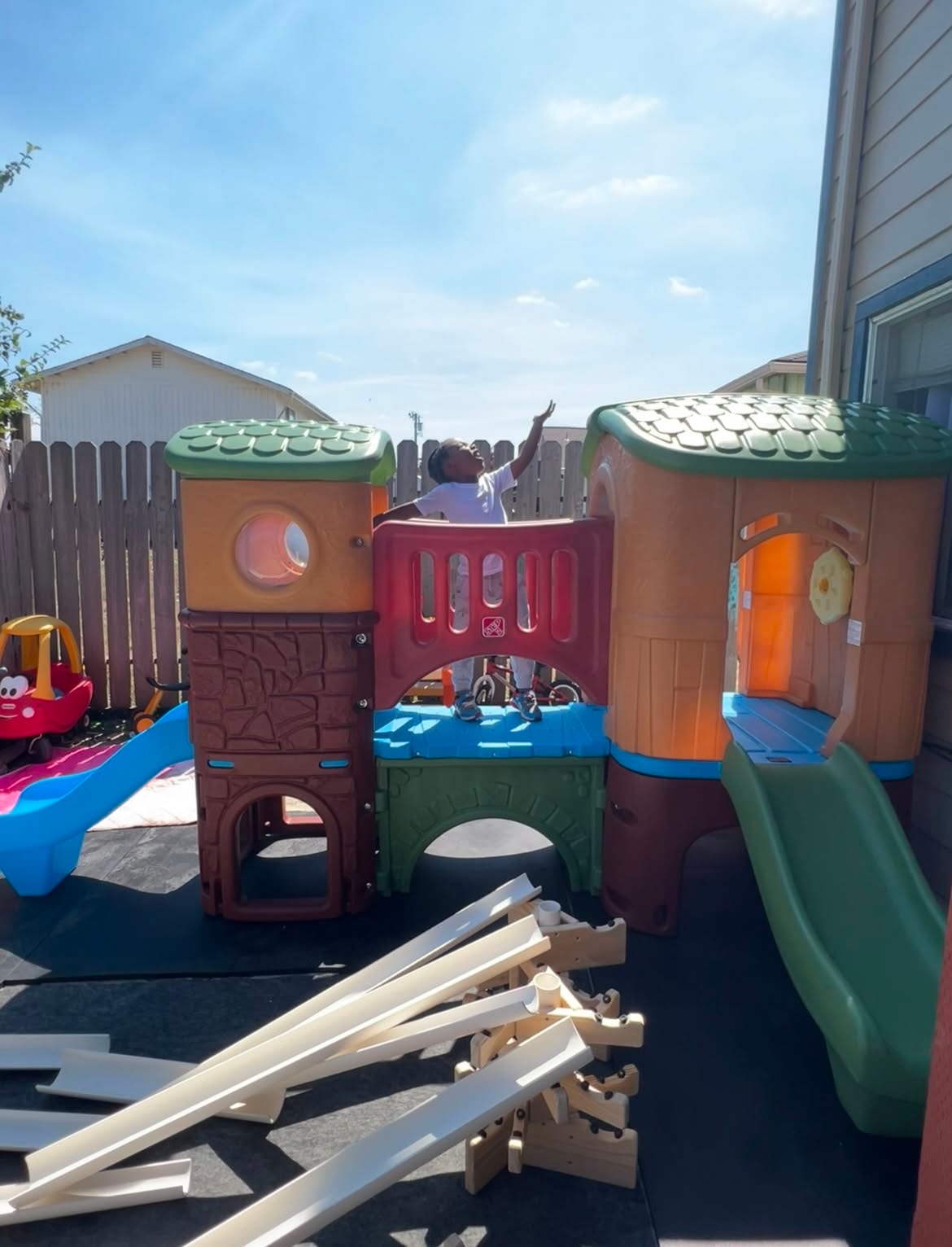 Child enjoying an outdoor play structure