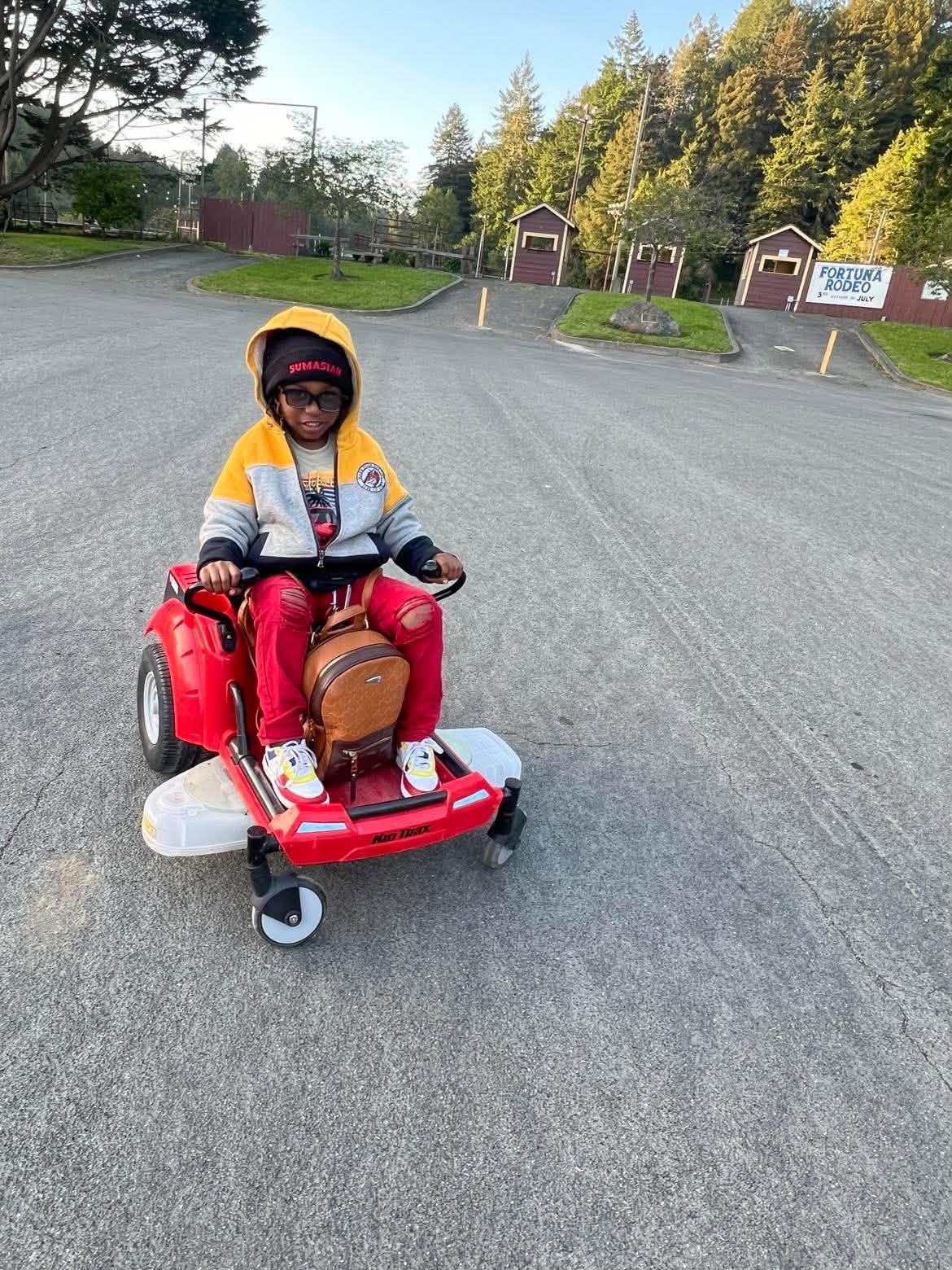 Child enjoying an outdoor mobility vehicle adventure