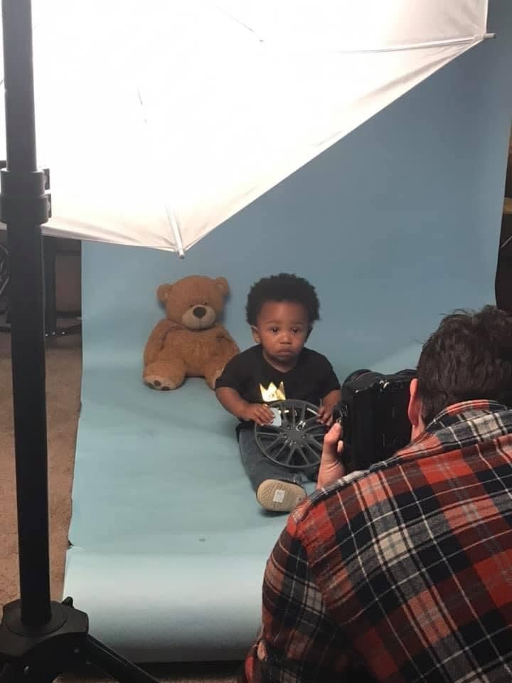Child taking part in a studio photo session