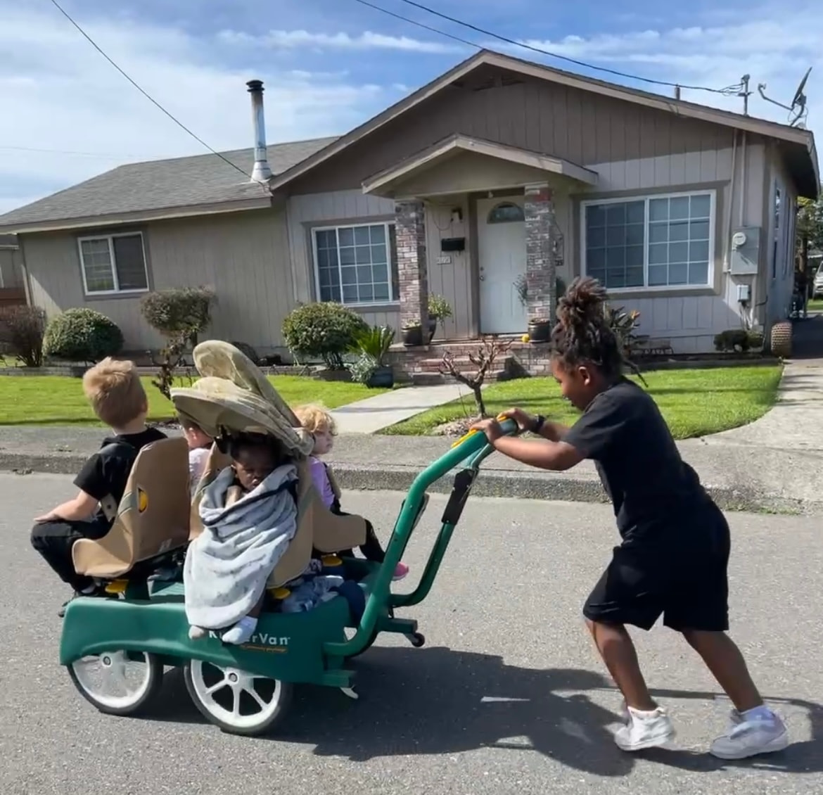 Children enjoying a neighborhood wagon ride together