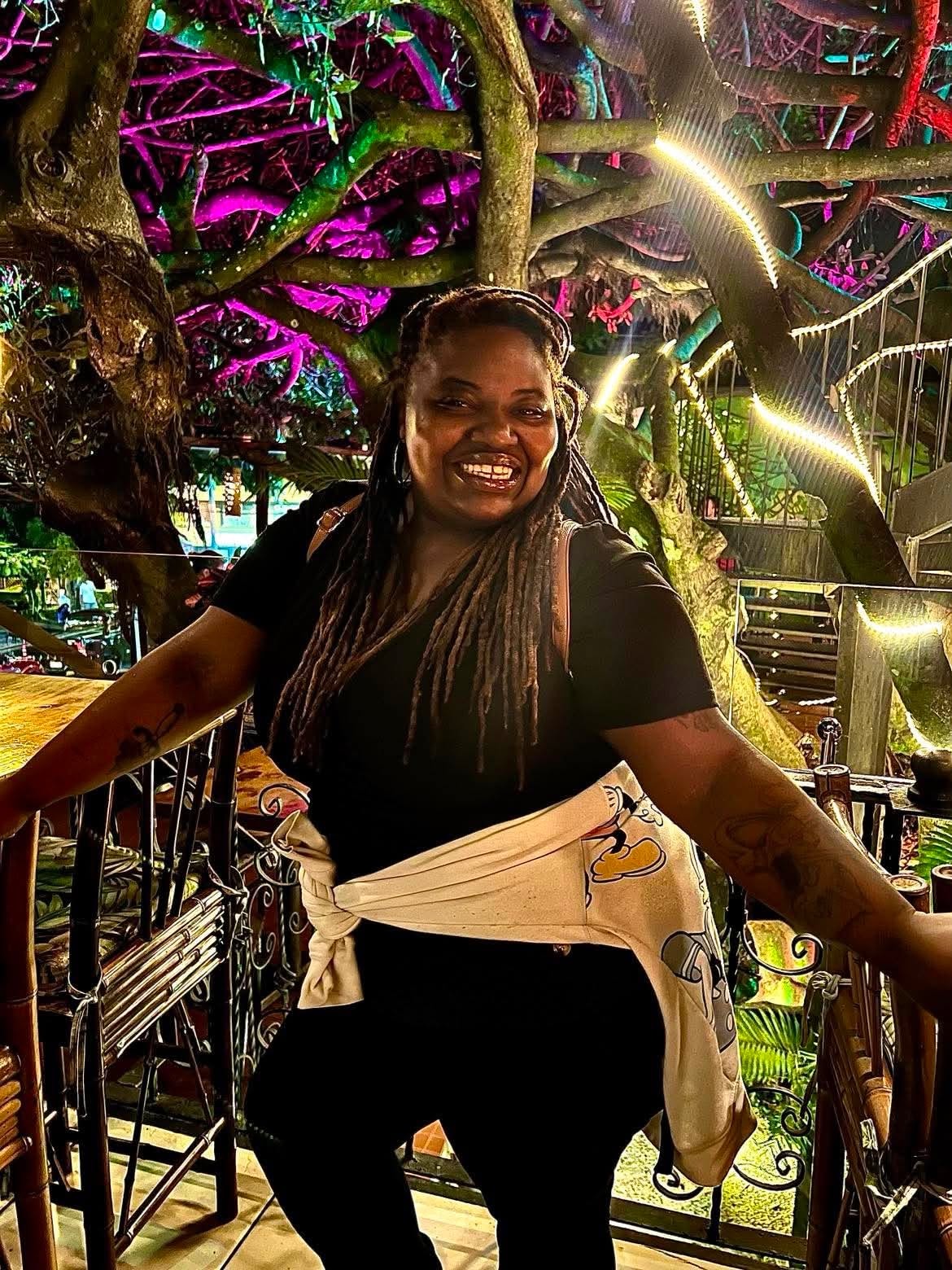 Community member enjoying a colorful evening garden setting