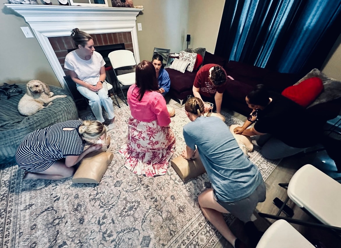 Community members learning CPR together