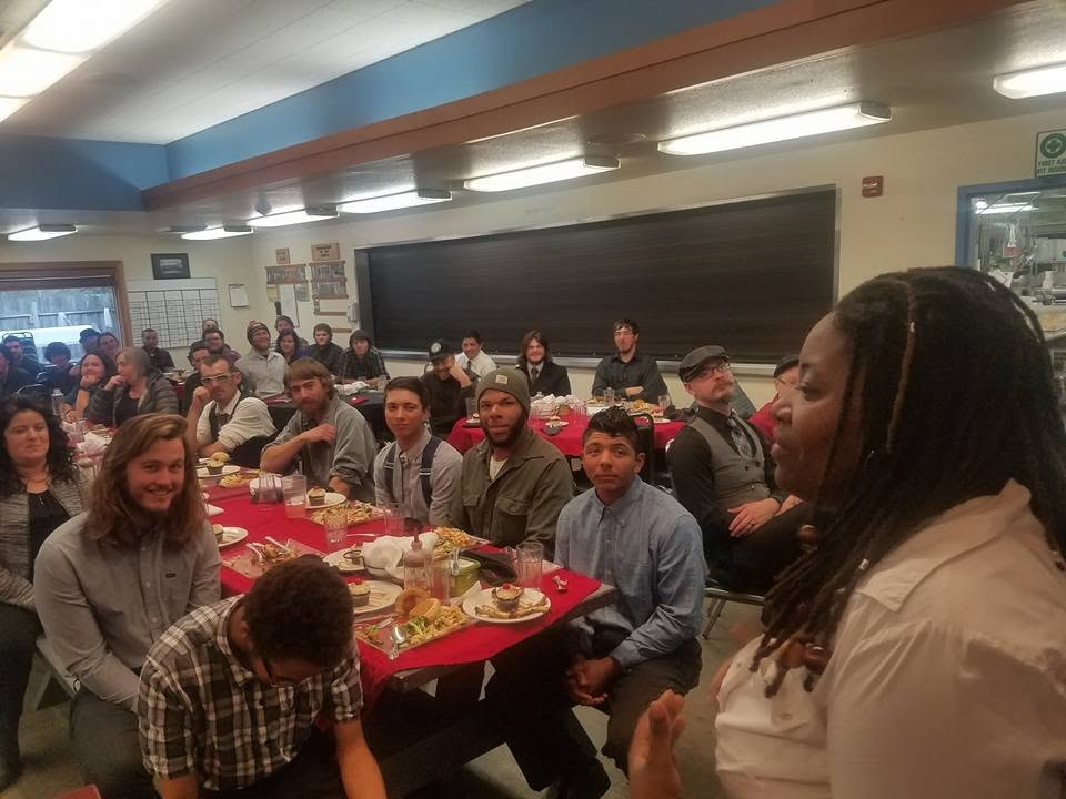 Community dinner with a speaker addressing guests