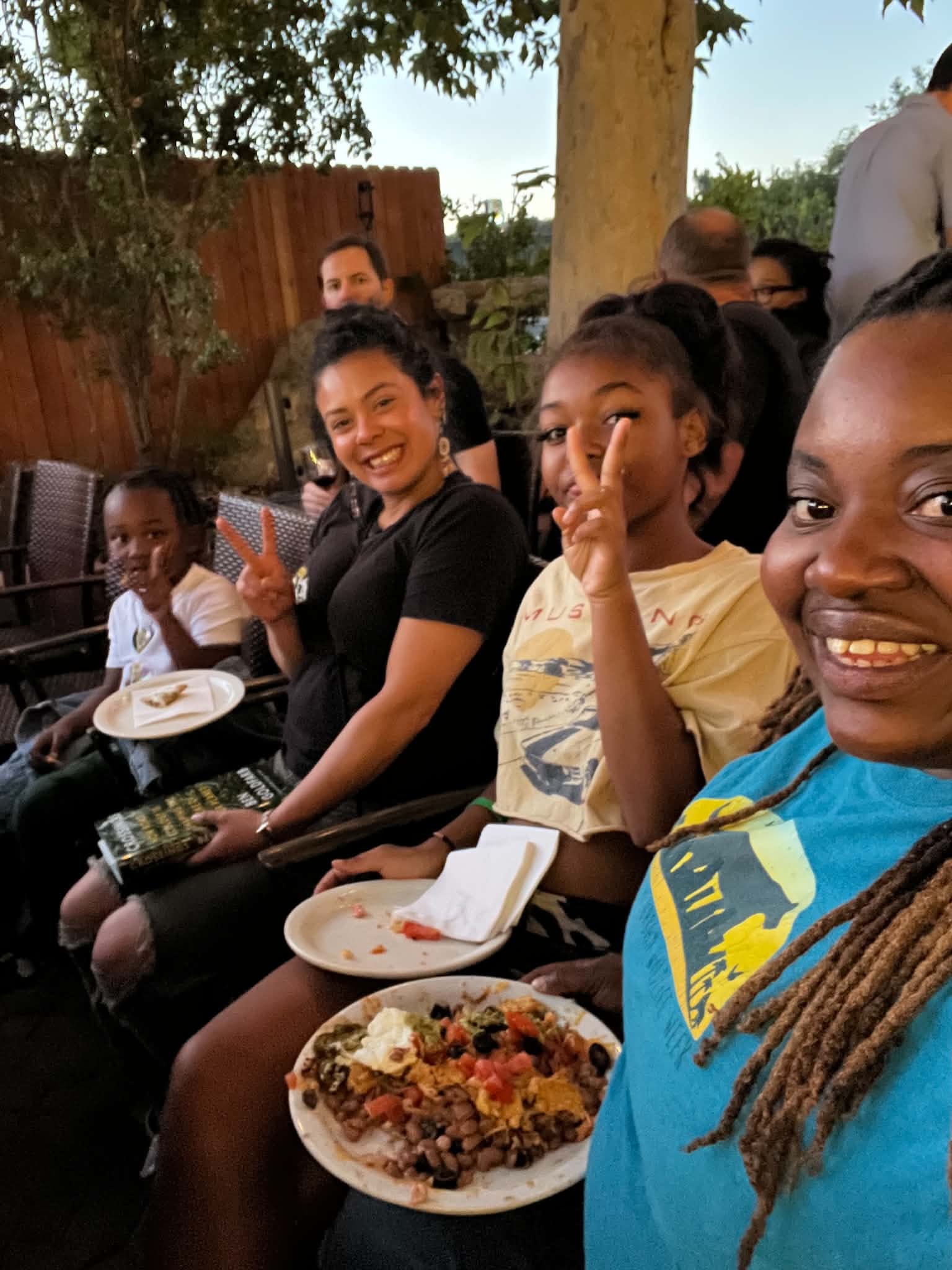 Friends and families sharing a meal at a community gathering