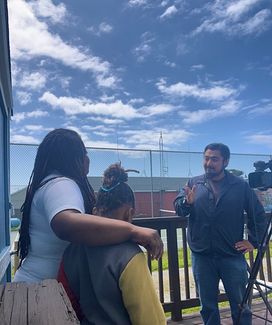 Community members speaking during an outdoor interview