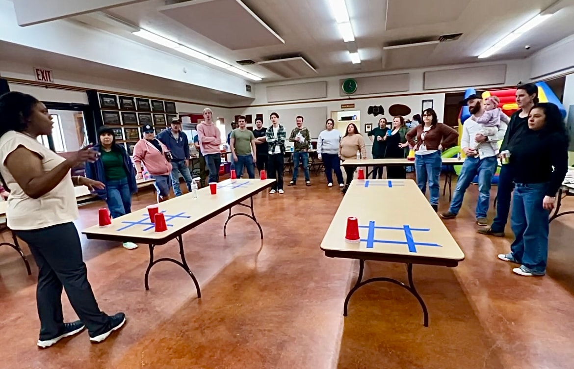 Community members gathering for an indoor activity