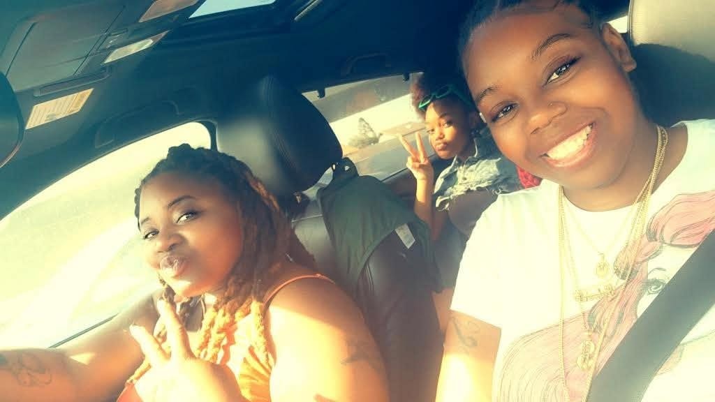 Family sharing a joyful road-trip moment together