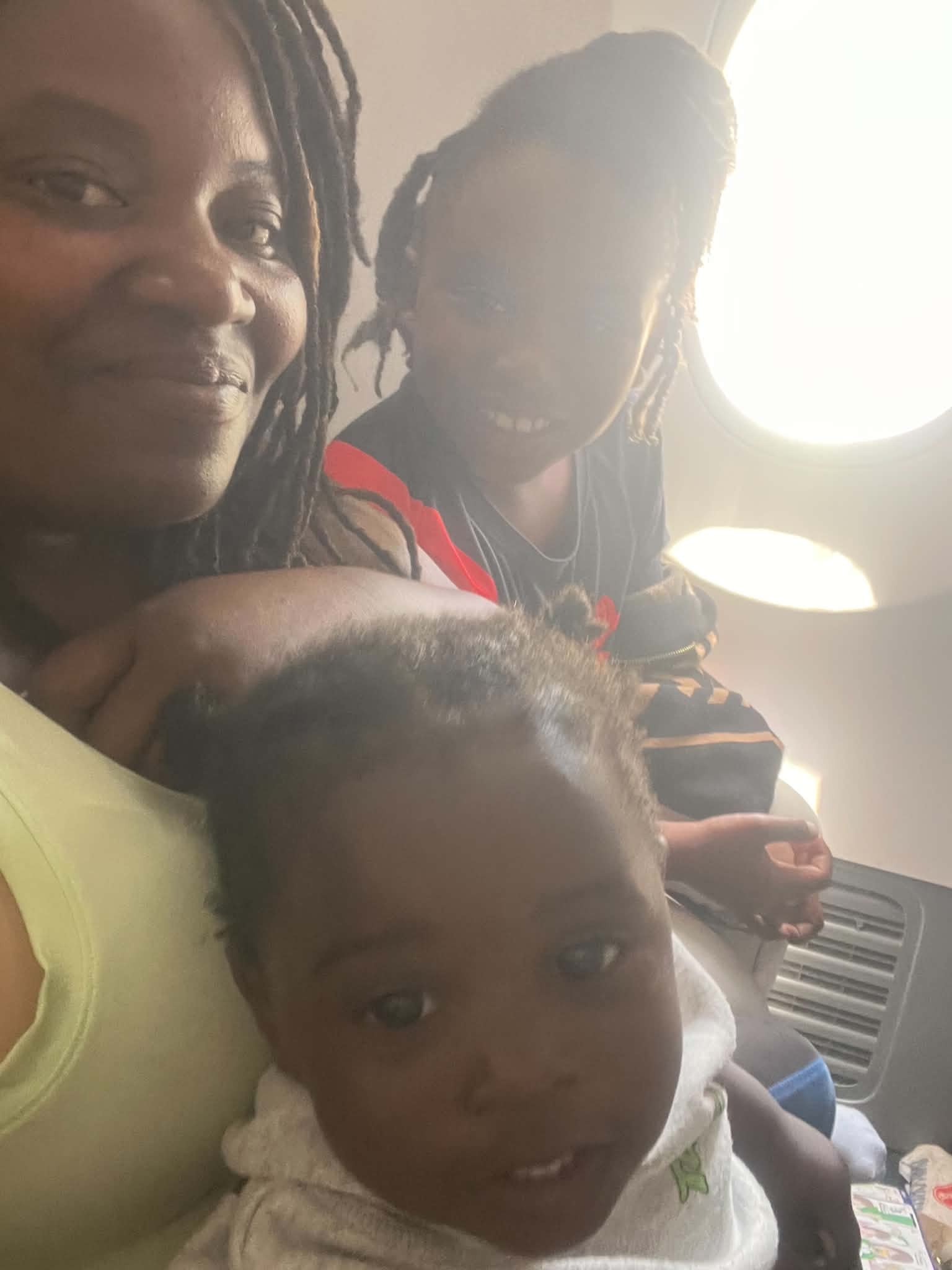 Family sharing a travel moment together in a car