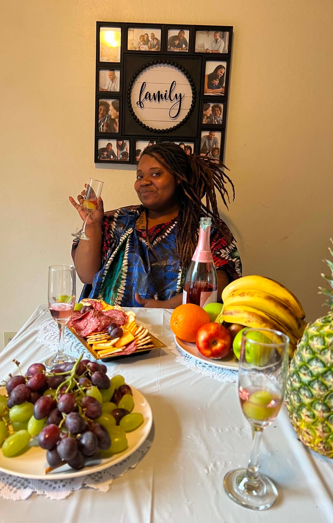 Community member celebrating with a family table spread