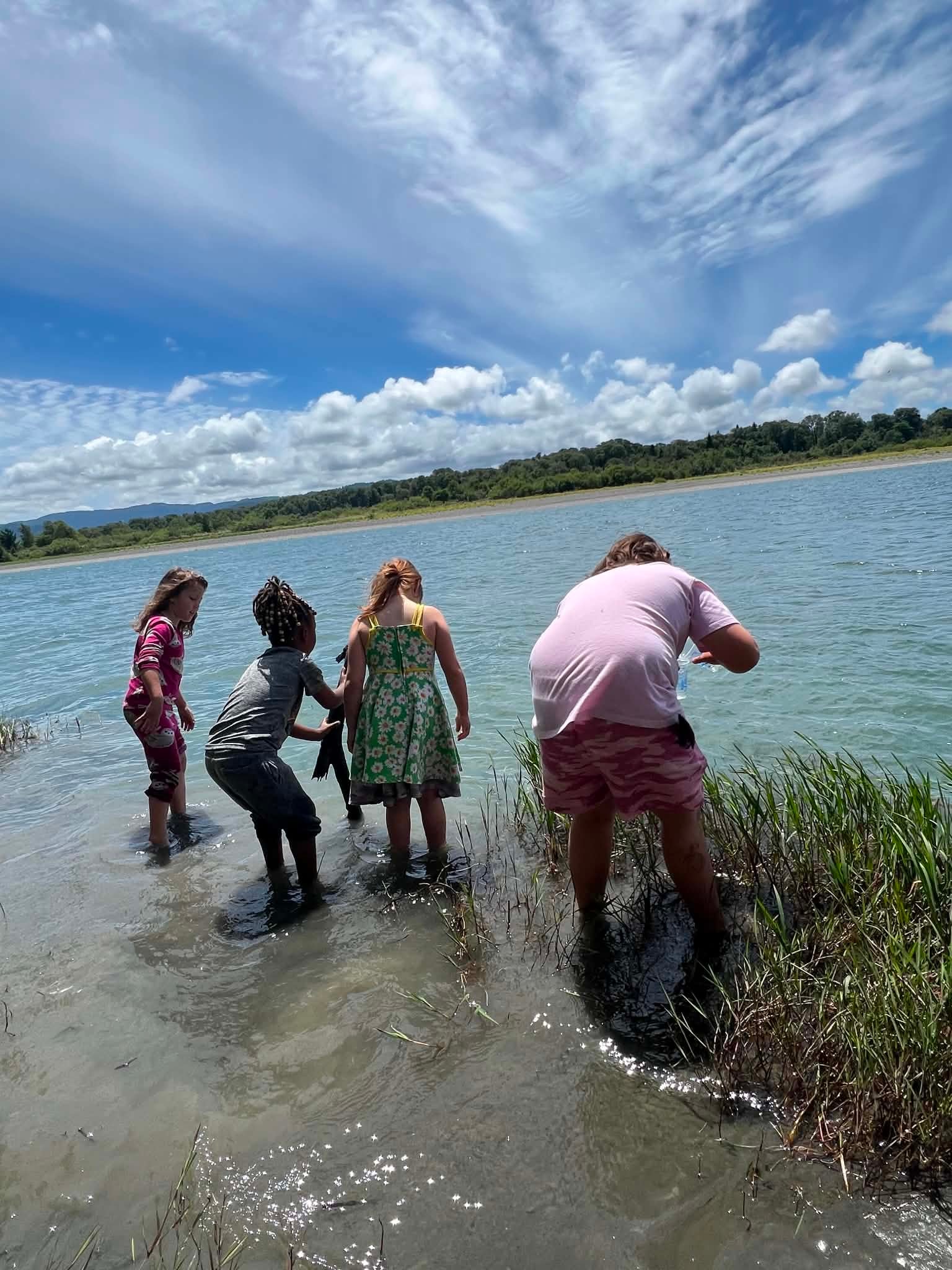 Families exploring together at the lakeside