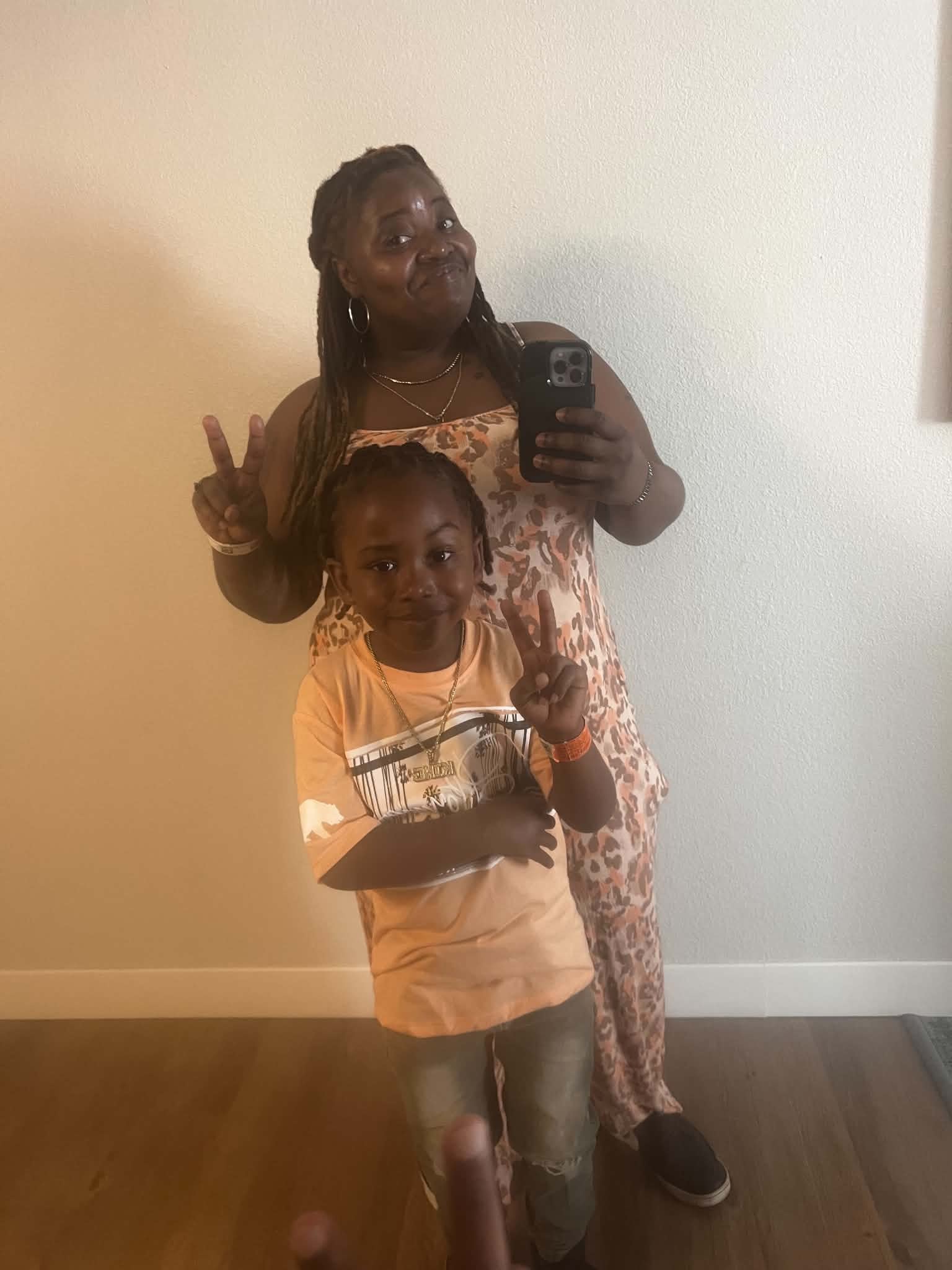 Family posing together in a mirror portrait