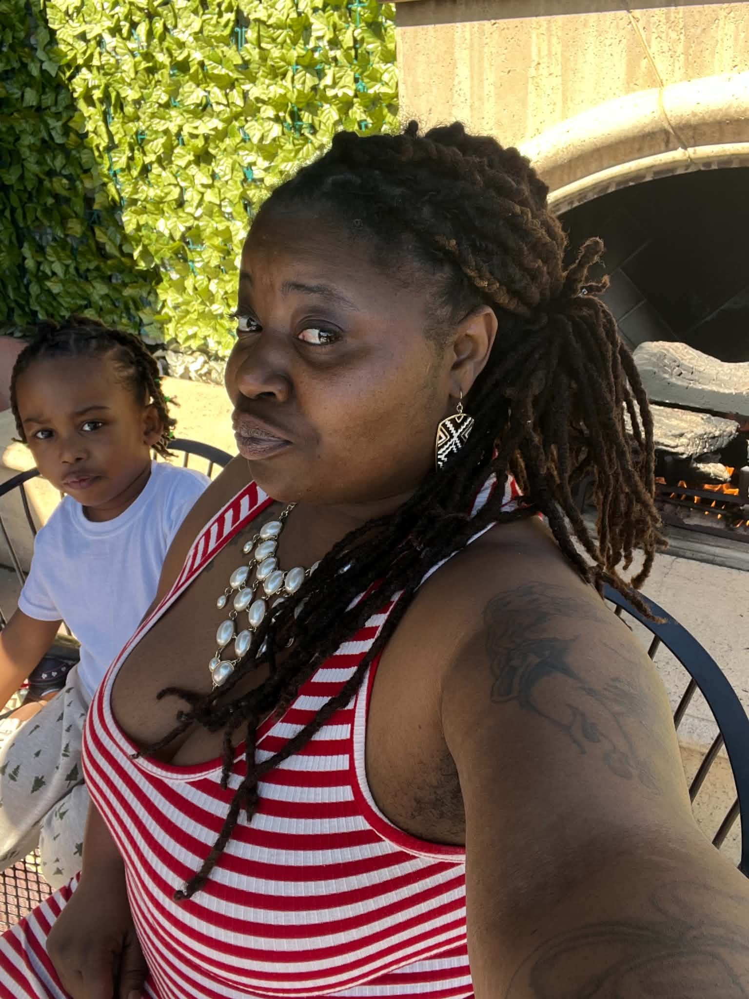 Mother and child enjoying a relaxed outdoor patio moment