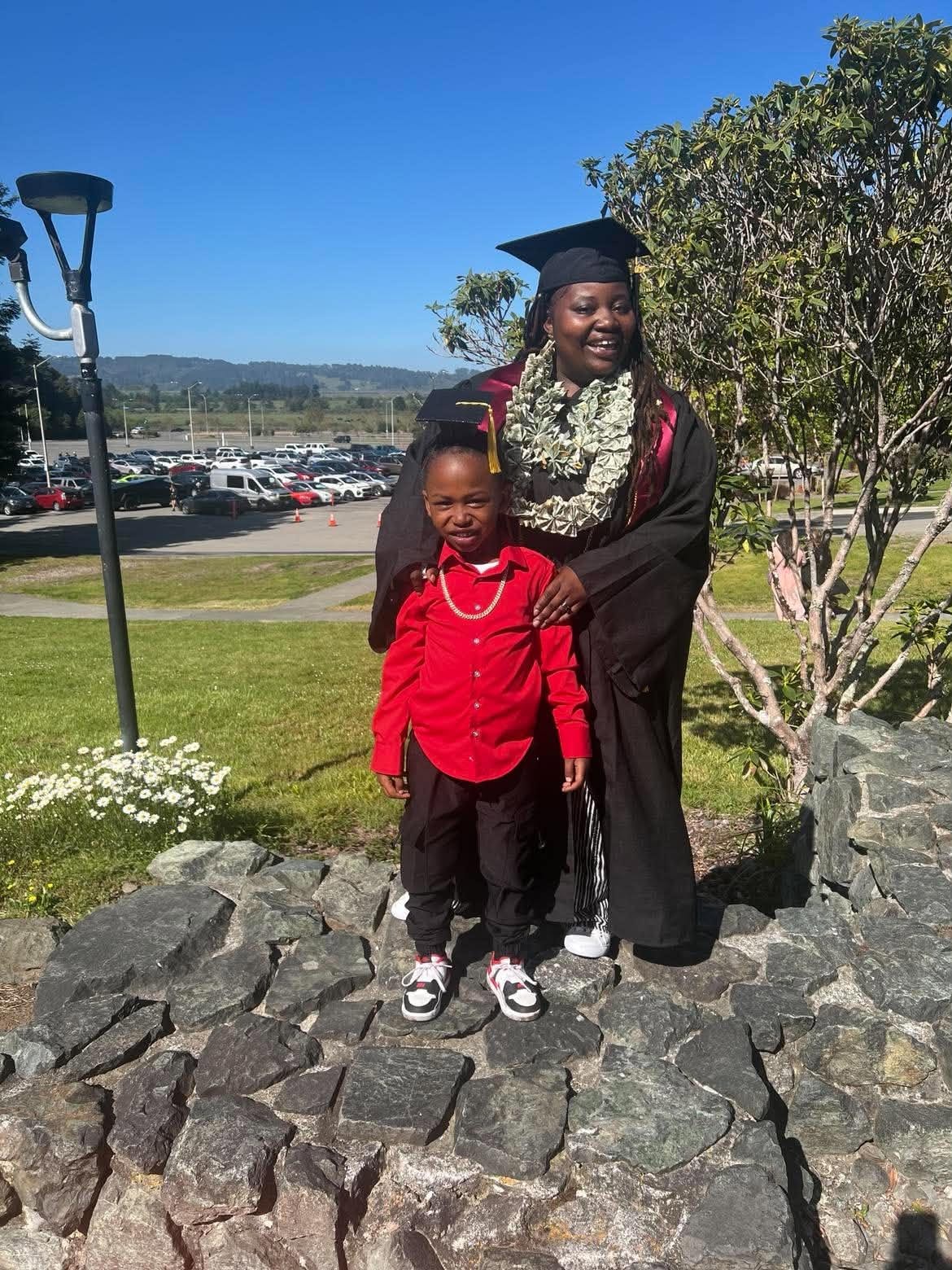 Graduate and child celebrating a milestone together