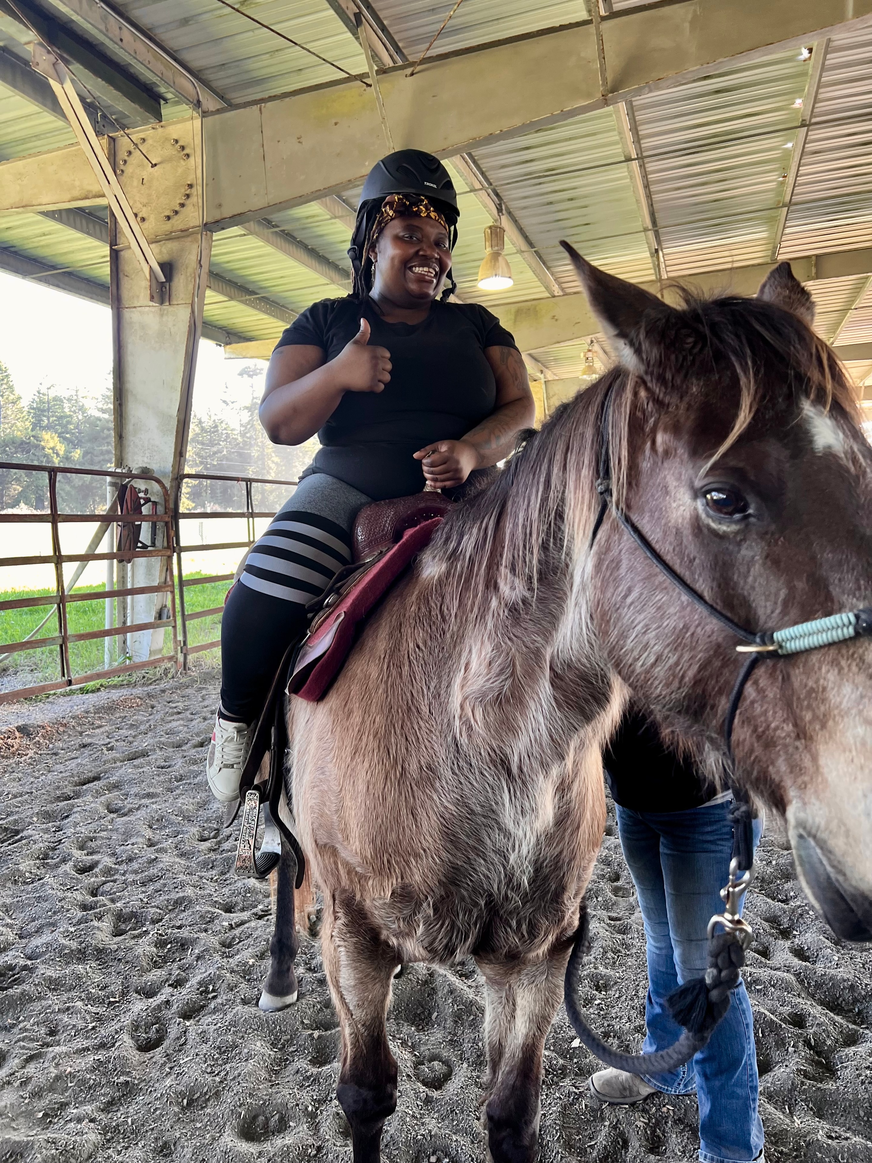 Community member enjoying a horseback riding experience