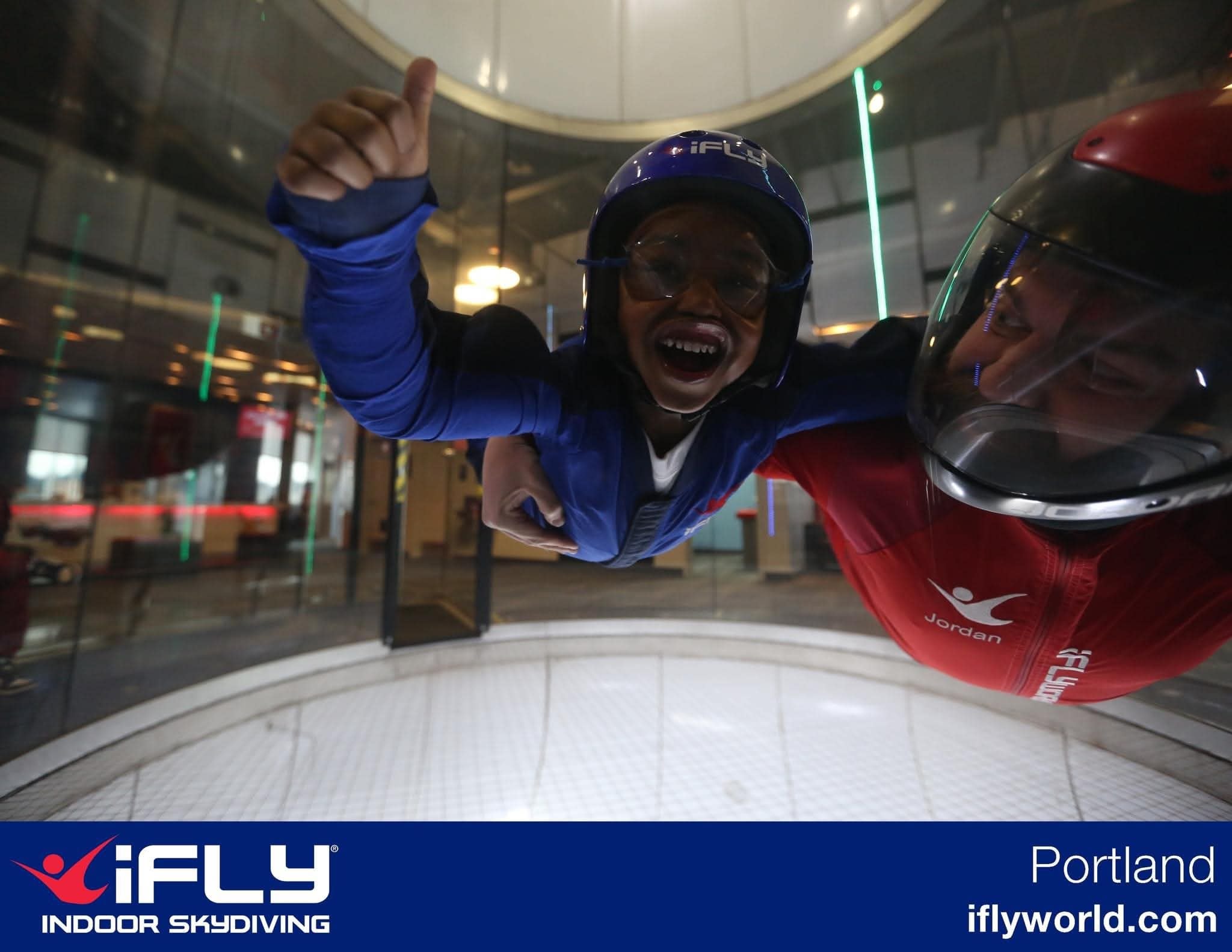 Child enjoying an indoor skydiving experience at iFLY Portland