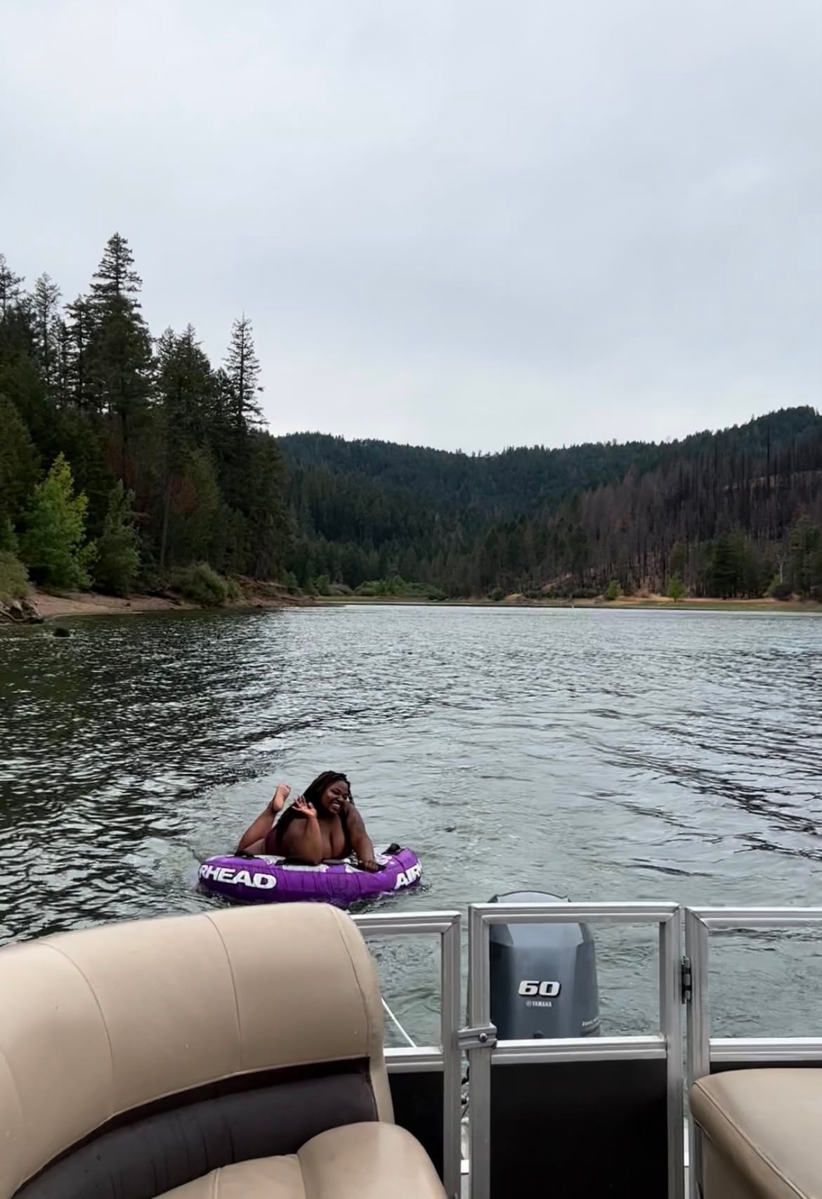 Community member enjoying a lake tubing adventure