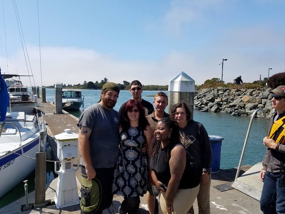Community group gathered on a marina dock