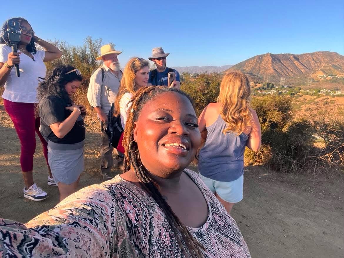 Community members taking in a mountain overlook together