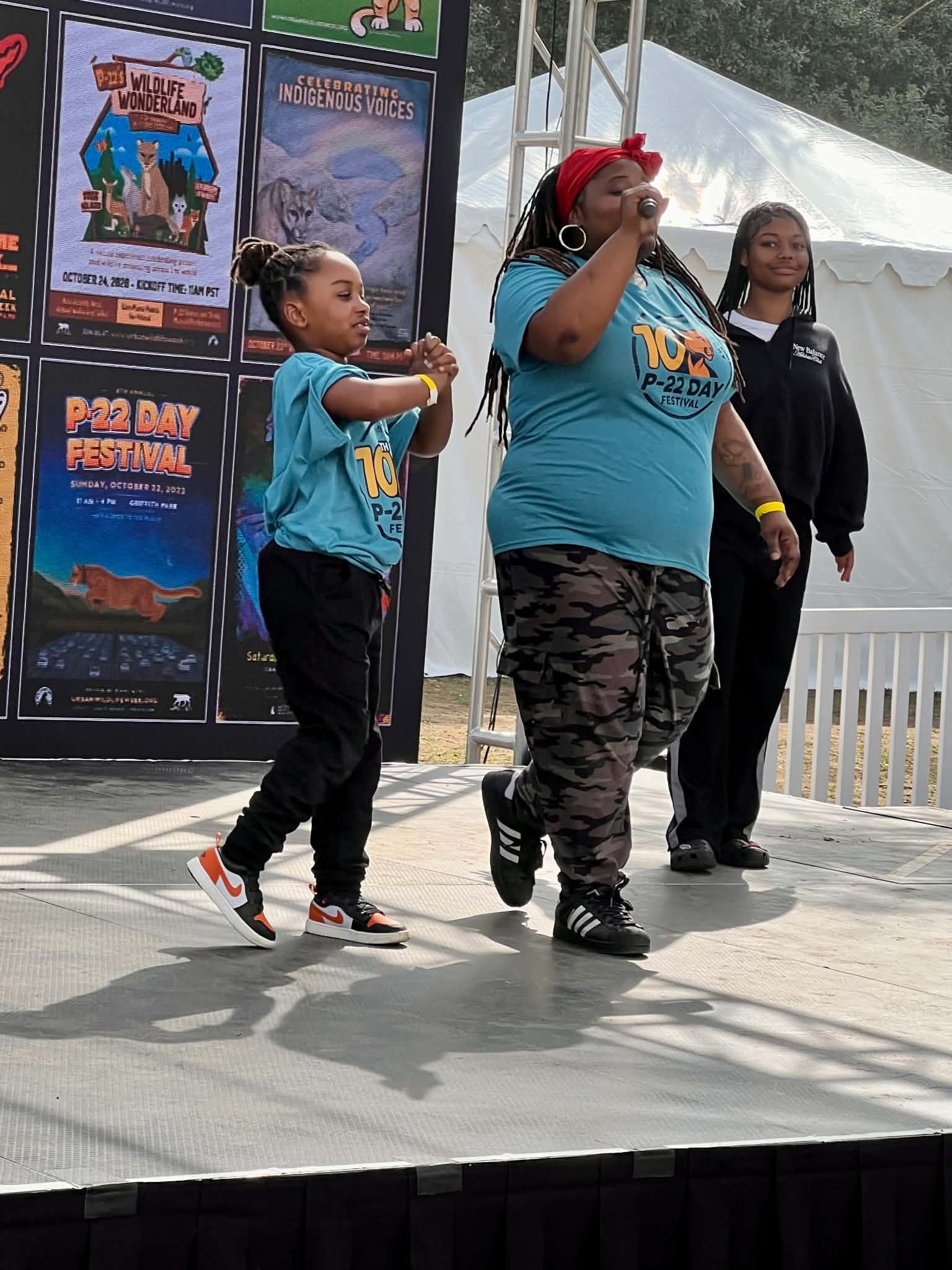Community members performing together at the P-22 Day Festival