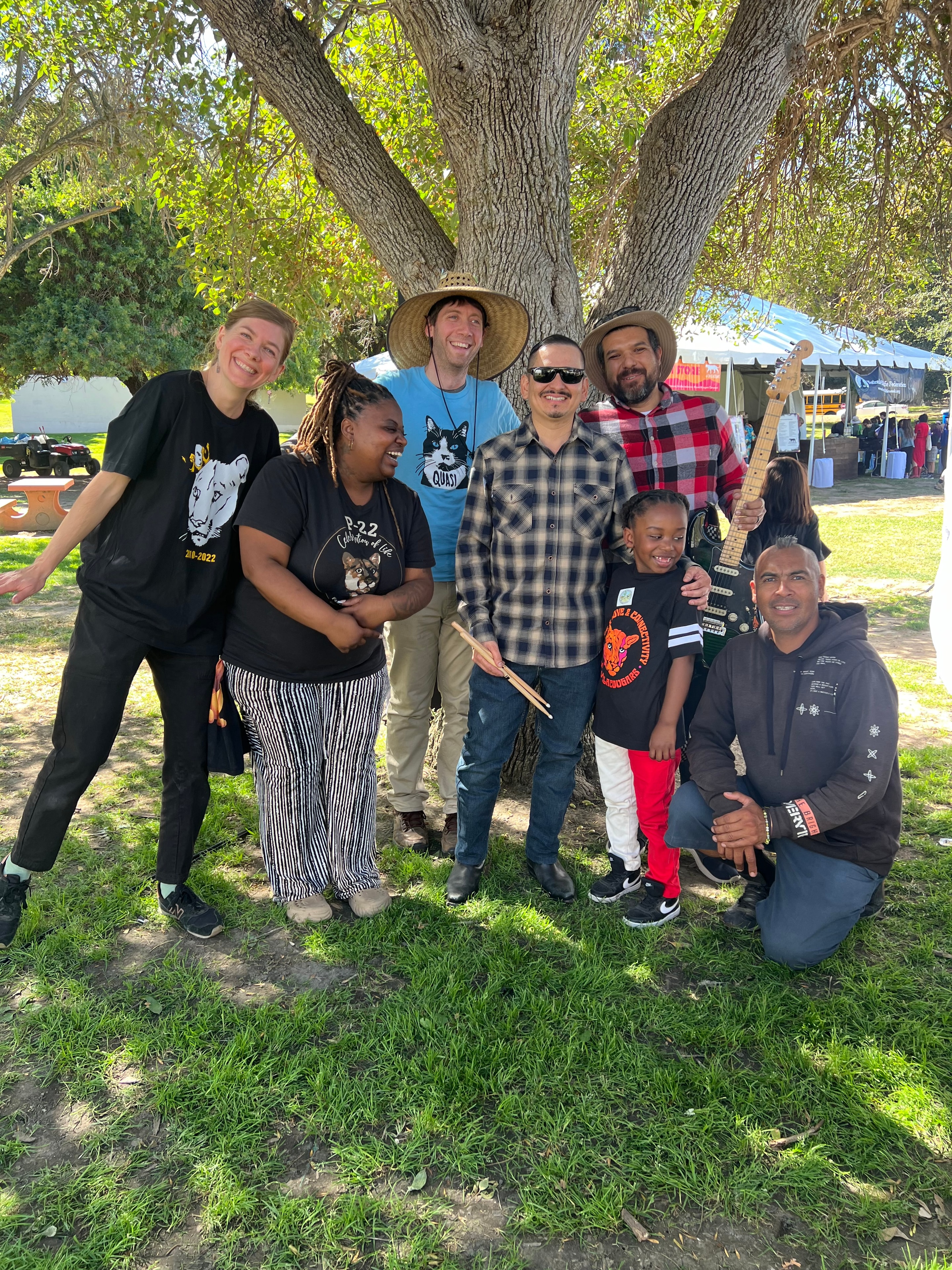 Community group with musicians gathered outdoors