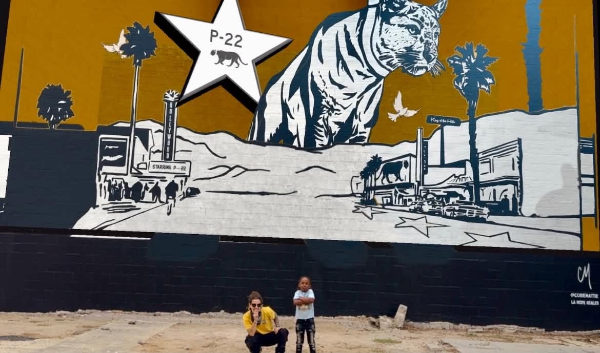 Community members at the P-22 tiger mural