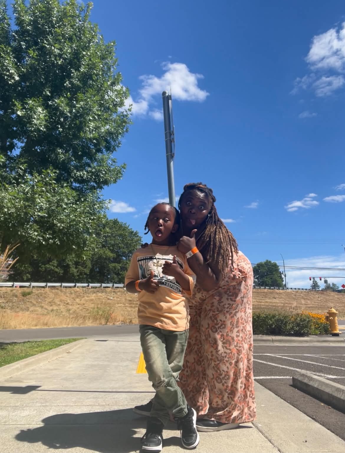 Adult and child having fun outdoors together