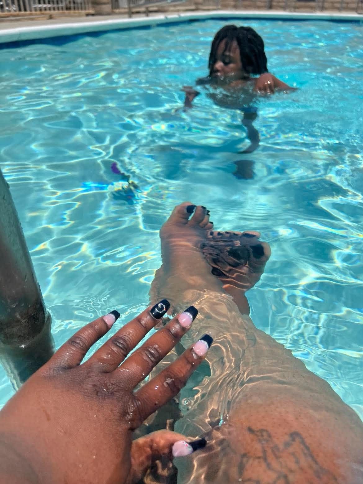 Family sharing a playful moment in the pool