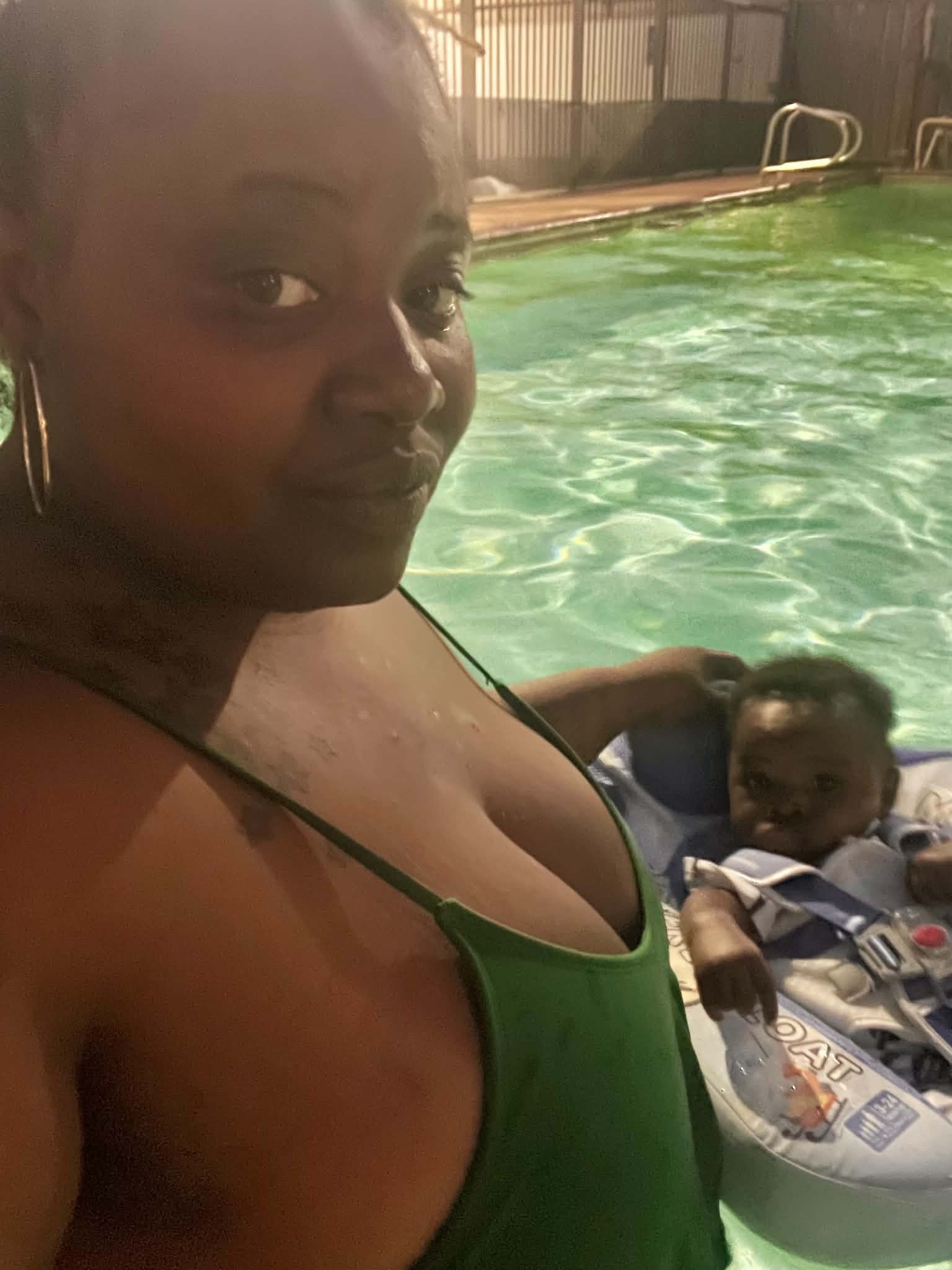Adult and child enjoying a pool day together