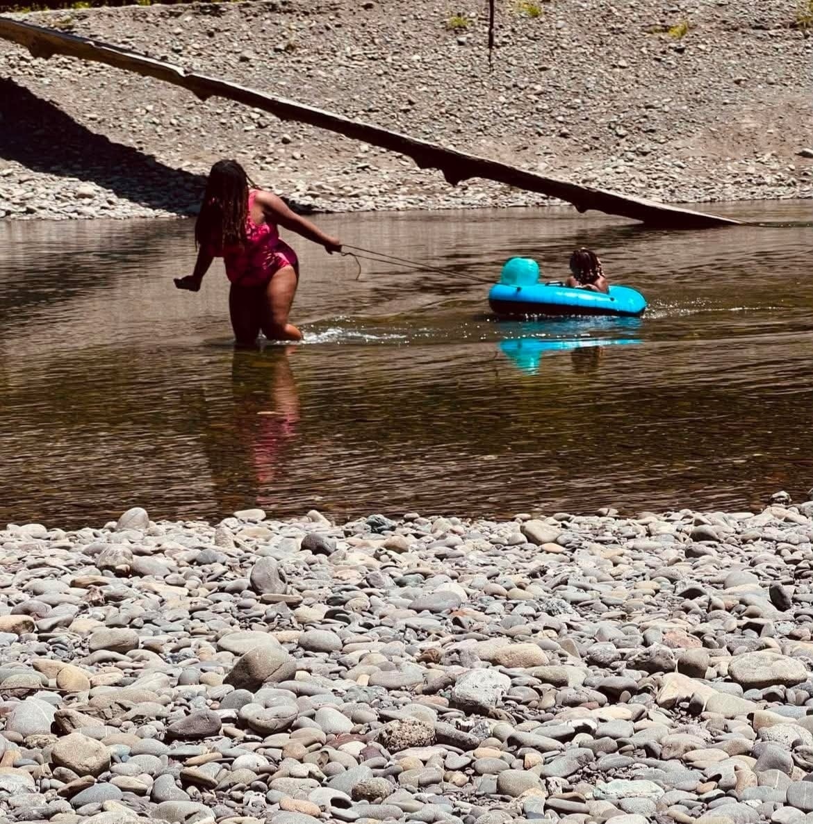 Child relaxing in a float during a river outing