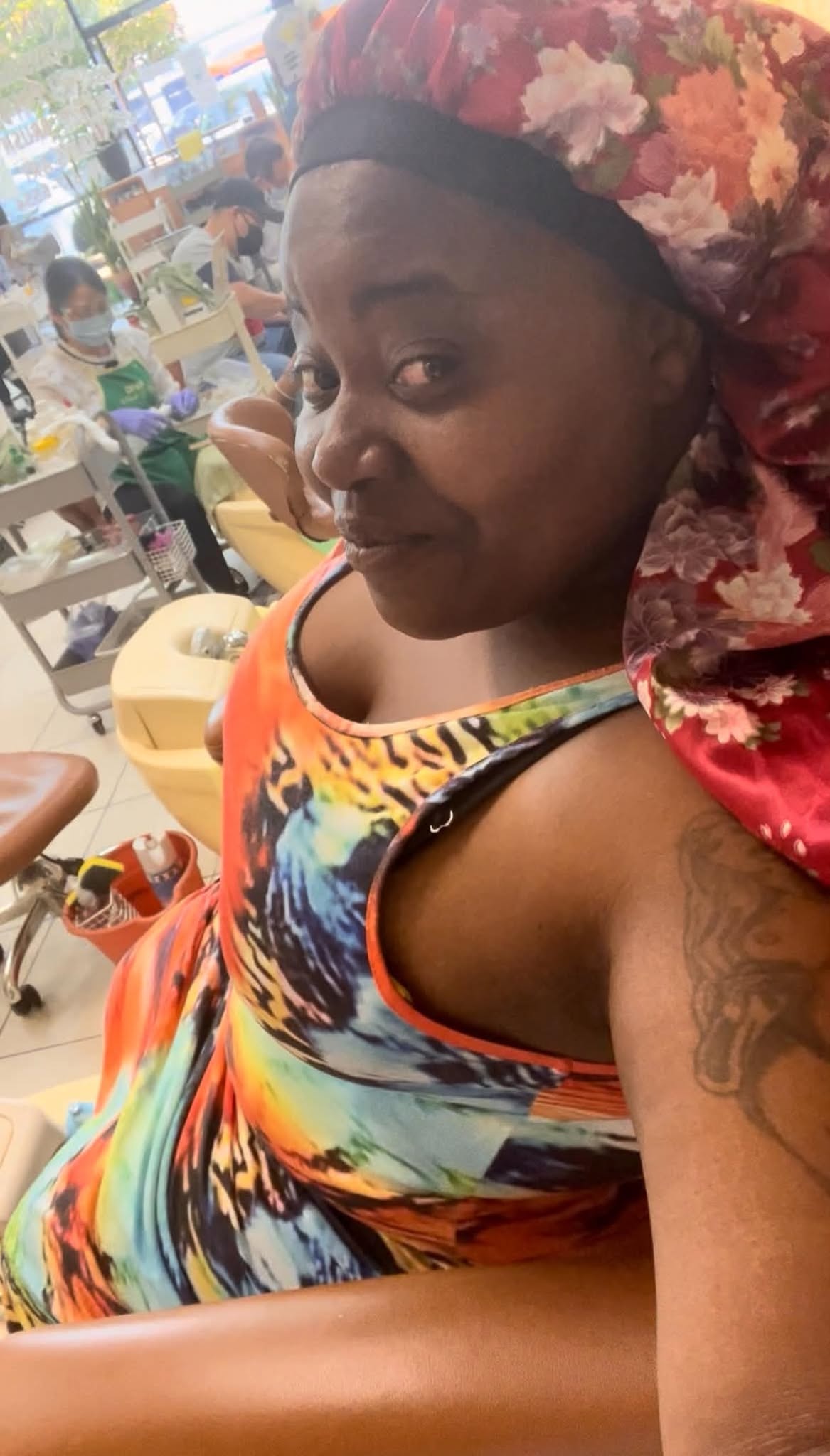 Community member sharing a colorful salon-day portrait