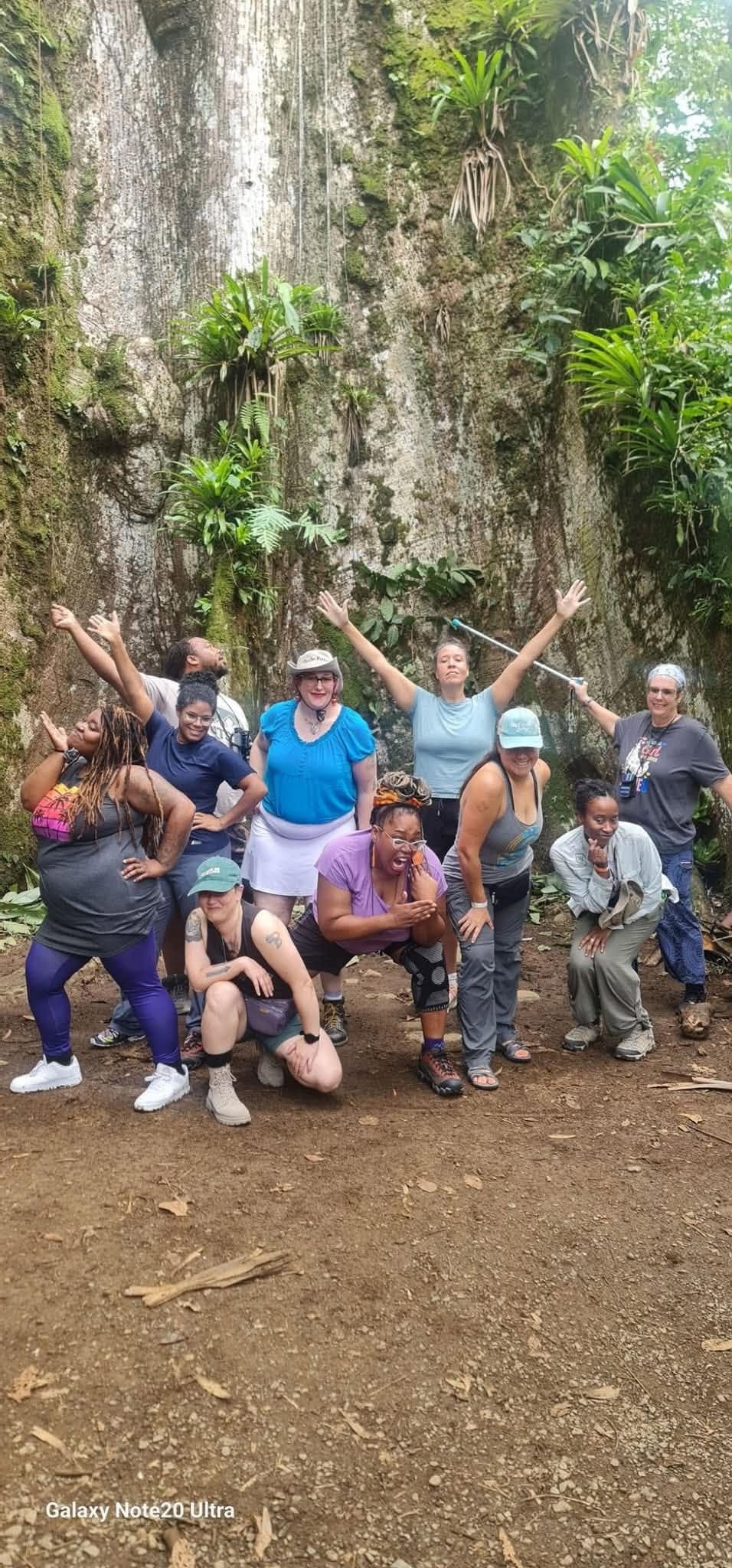 Community group gathering in a lush tropical setting
