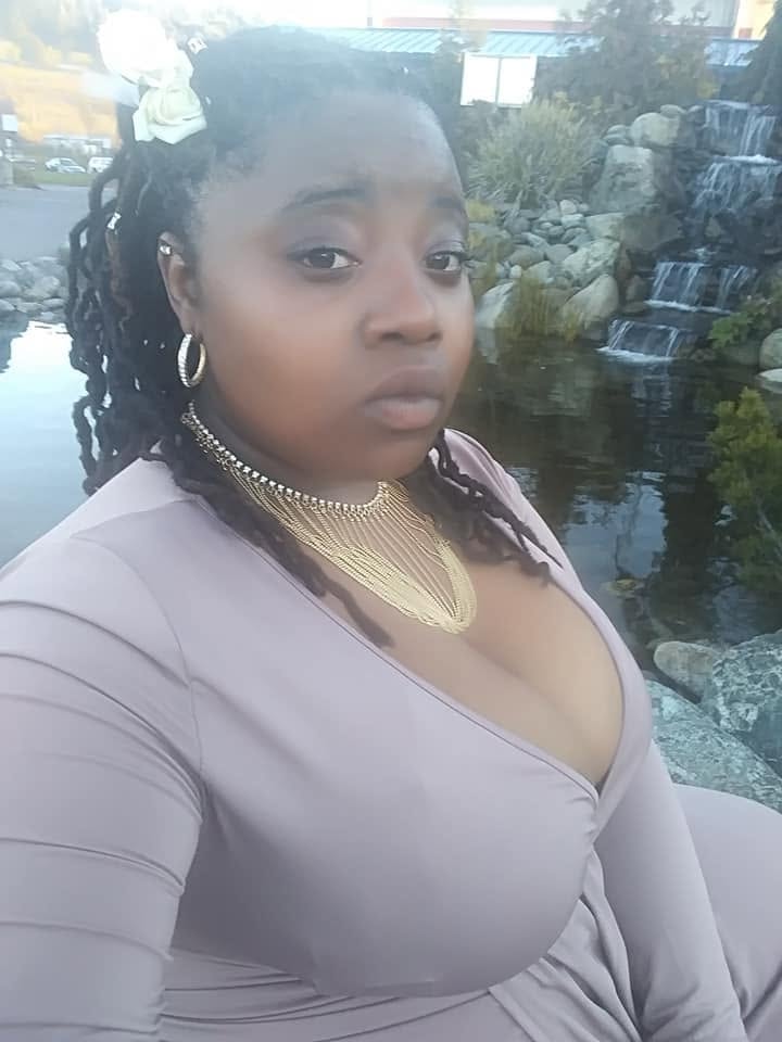 Community member near a landscaped waterfall